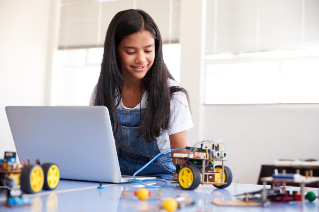 Female Student Building And Programing Robo