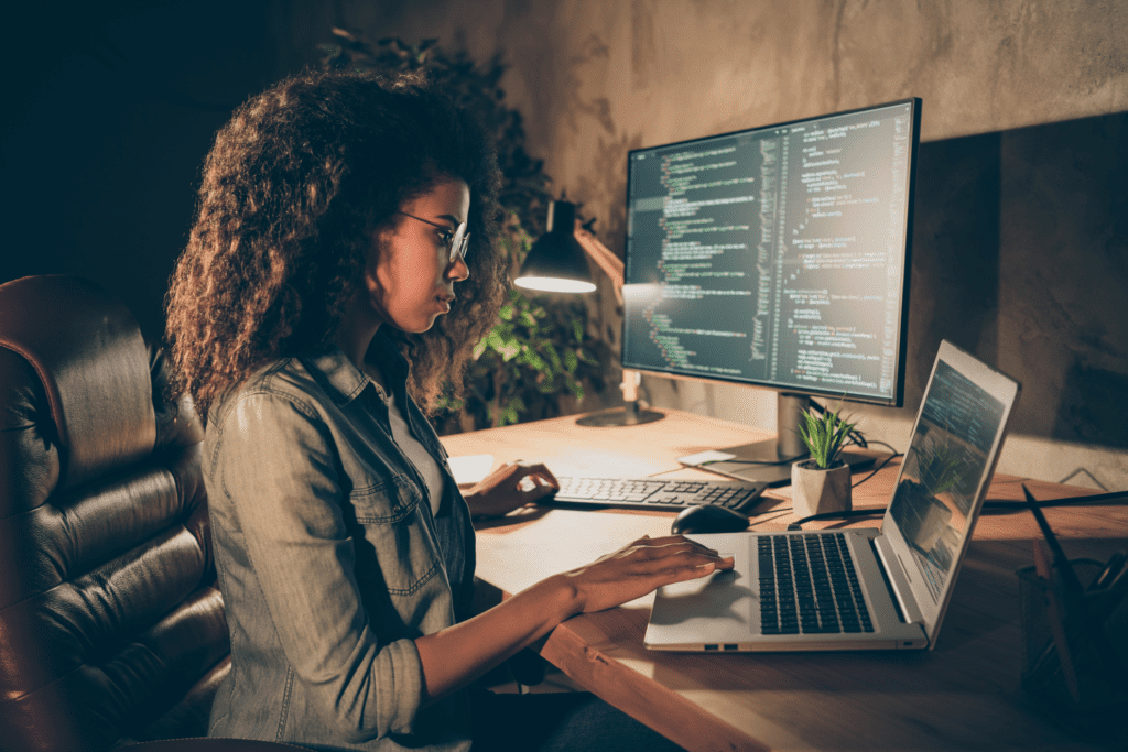 African American woman analyzing the code